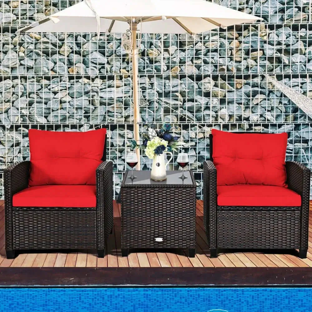 Cozy patio seating with red cushions under an umbrella, perfect for relaxation by the pool.