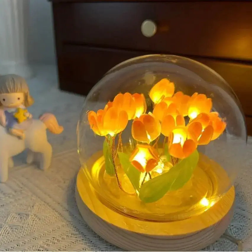 Artisanal Tulip Desk Lamp with warm glowing LED tulips in a glass dome, perfect for creating a cozy atmosphere.