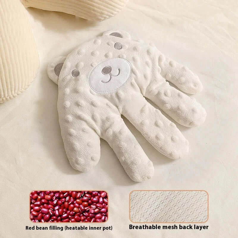 Soft bear-shaped hand warmer with red bean filling and breathable mesh back for comforting warmth.