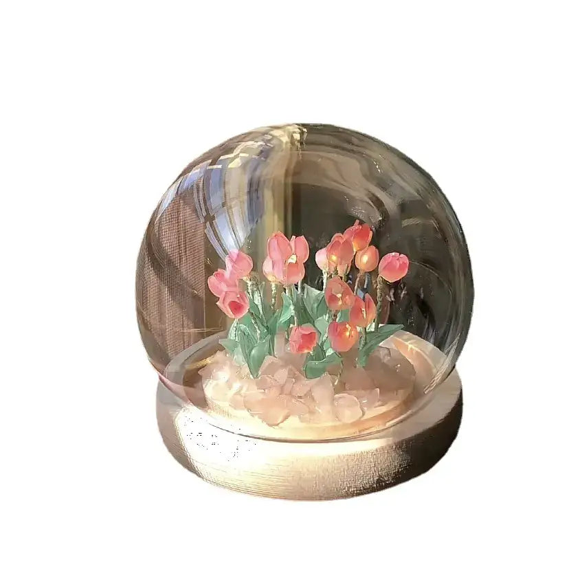 Artisanal tulip snow globe with pink tulips and decorative base, perfect for home decoration and gifting.