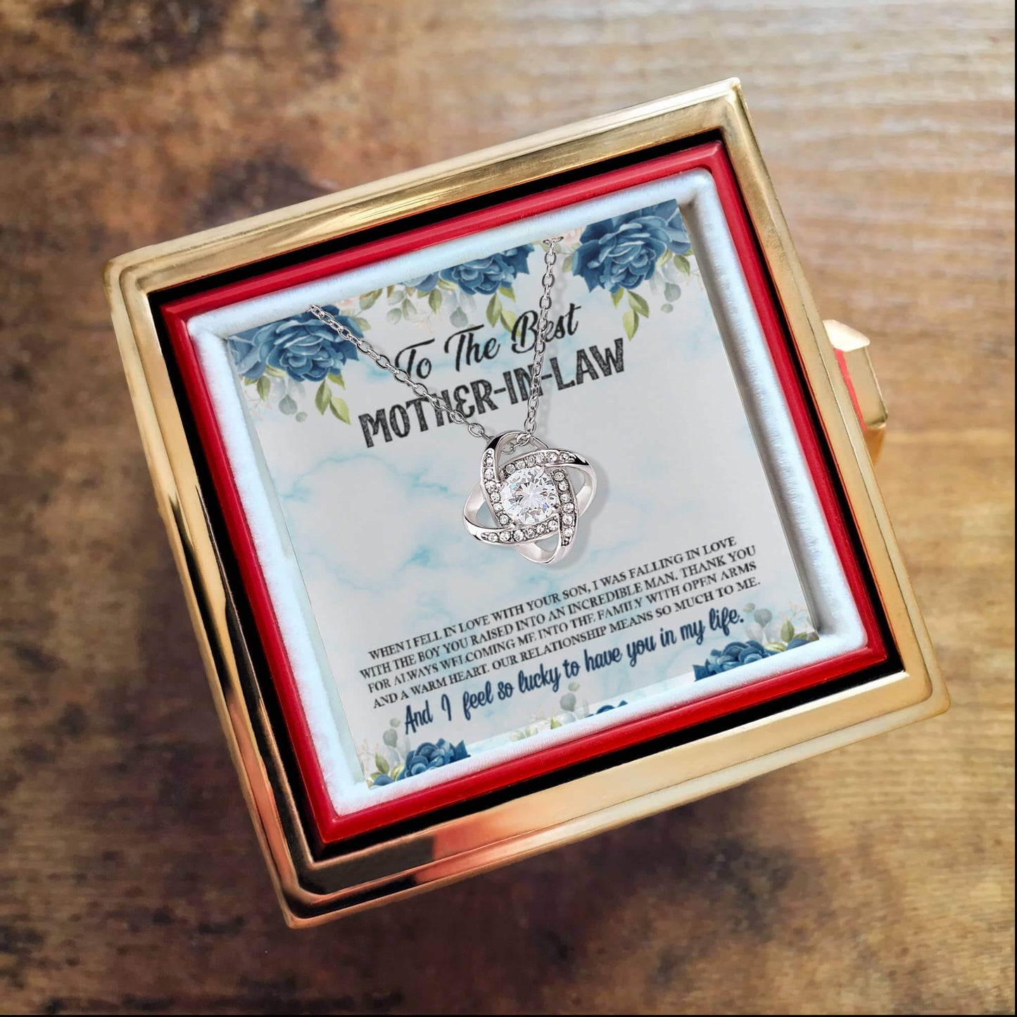 Gold box with Love Knot Necklace for Mother-in-Law, featuring premium cubic zirconia and heartfelt message.
