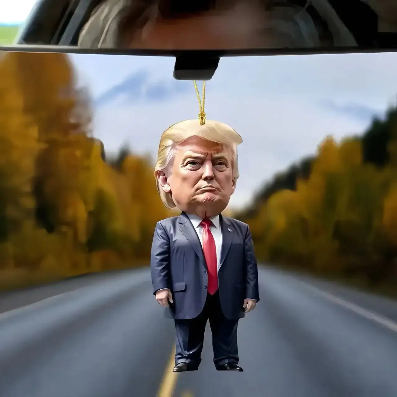 Car air freshener figurine featuring a cartoon-style character resembling a businessman on a scenic road.