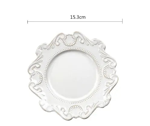 Elegant white Baroque-style porcelain plate with intricate detailing, measuring 15.3cm in diameter.