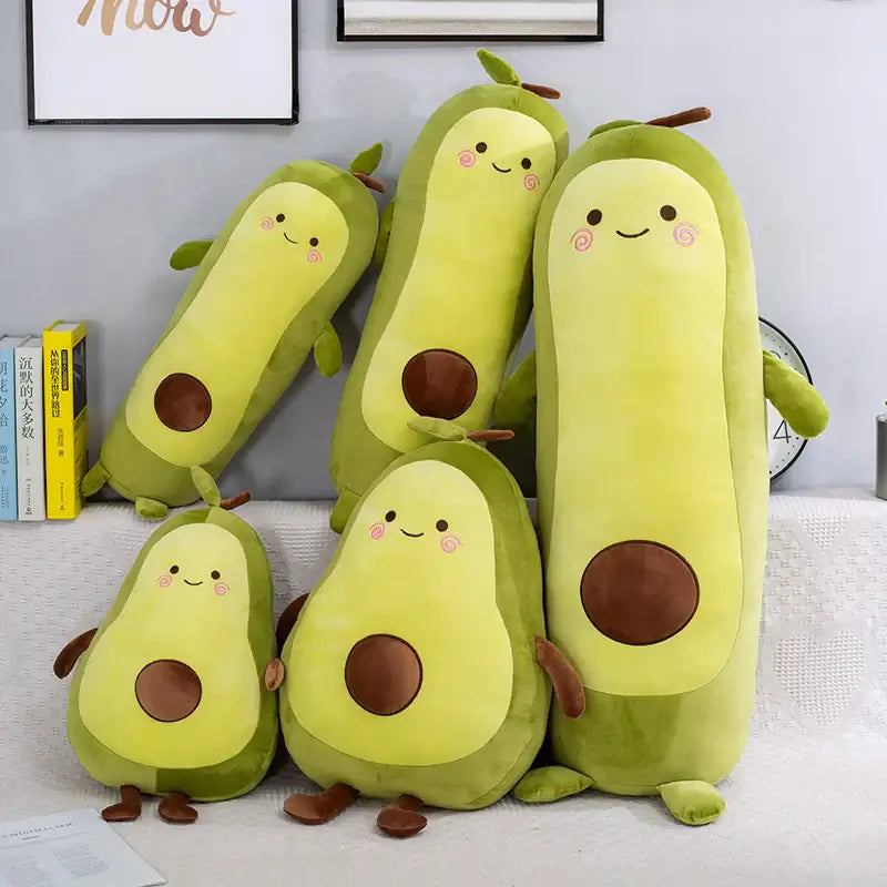 Cuddle Avocado Soft Pillows in various sizes, perfect for napping and playful decor.
