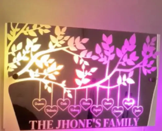 Personalized family tree wall art with LED lights, highlighting 'The Jhone's Family' with names on heart ornaments.