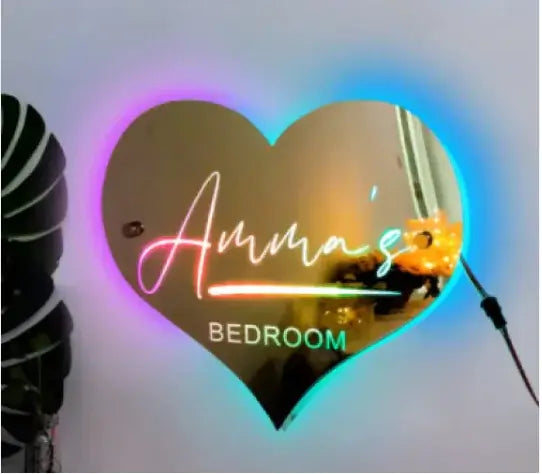 Personalized LED heart-shaped mirror with customizable text for bedroom decor.