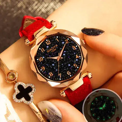 Quartz women's watch with luminous starry design, red strap, and elegant gold accents for a stylish look.