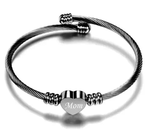 Stainless steel braided bracelet with heart charm engraved 'Mom', perfect gift for Mother's Day.