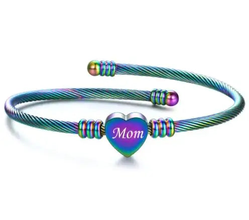 Colorful stainless steel braided bracelet with heart charm engraved 'Mom', symbolizing love and appreciation for Mother's Day.