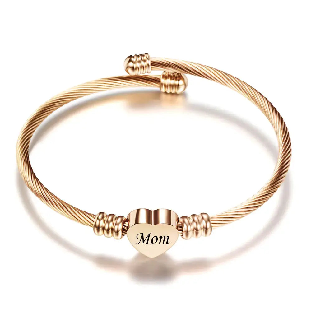 Stainless steel braided bracelet with heart charm engraved 'Mom', perfect for Mother's Day gift.