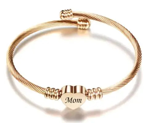 Stainless steel braided bracelet with heart charm engraved 'Mom', perfect Mother's Day gift for showing love and appreciation.
