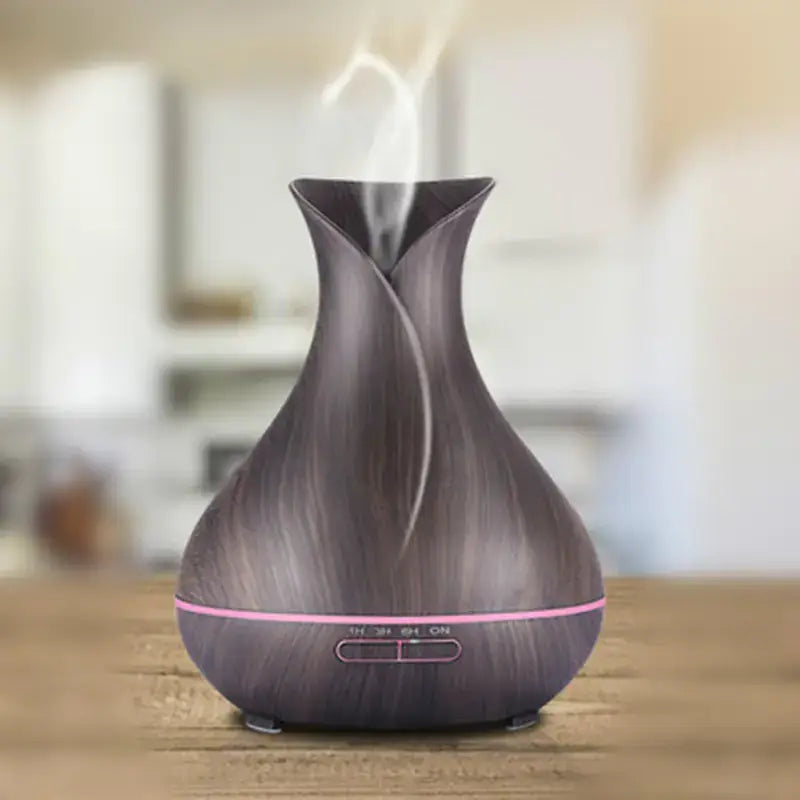 Wood grain aromatherapy diffuser and humidifier enhancing home decor with calming mist.