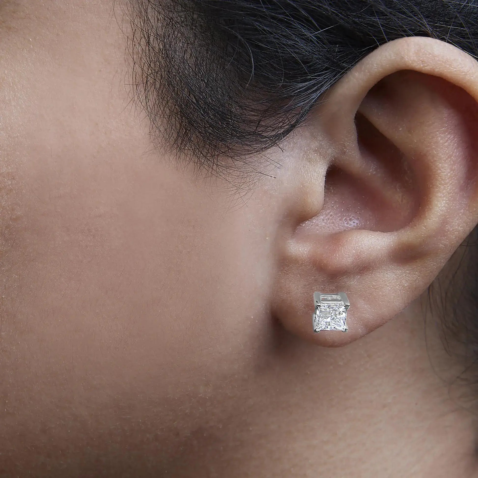 14K white gold solitaire stud earrings with princess cut lab-grown diamonds, showcasing elegant sparkle.