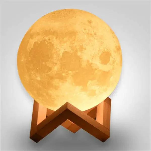 3D Touch Control Moon Lamp glowing yellow on wooden base, perfect for night light in home or hotel decor.