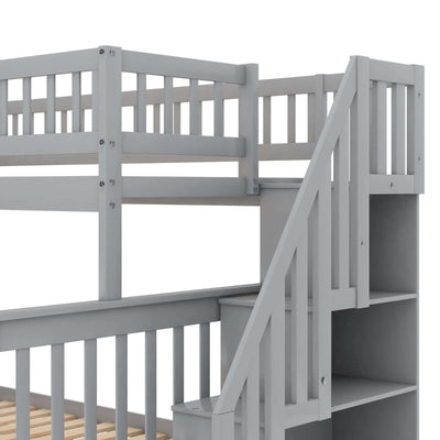 Gray twin over full bunk bed staircase and guardrails for safe sleeping with storage space.