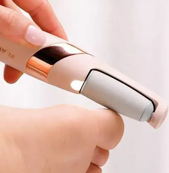 Close-up of SmoothFeet Electric Exfoliator in hand, highlighting its sleek design for effortless foot care and dead skin removal.
