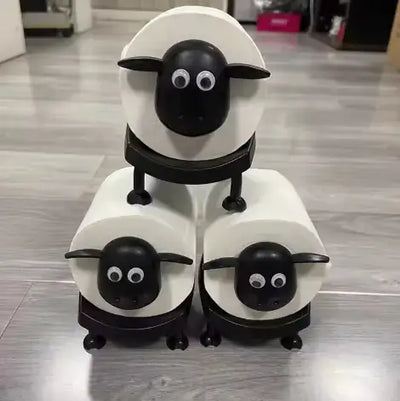 Cute sheep toilet paper roll holder design featuring three sheep holding rolls in playful, functional bathroom decor.