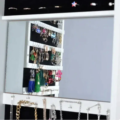 Swivel jewelry showcase mirror with earring storage and full-body reflection, perfect for organizing accessories.