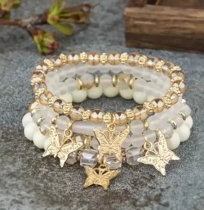 Butterfly Bliss Beaded Bracelets set featuring gold butterfly charms and colorful beads, perfect for stylish accessories.