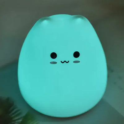 Cute cartoon night lamp glowing softly in blue, perfect for creating a whimsical ambiance for kids and adults.