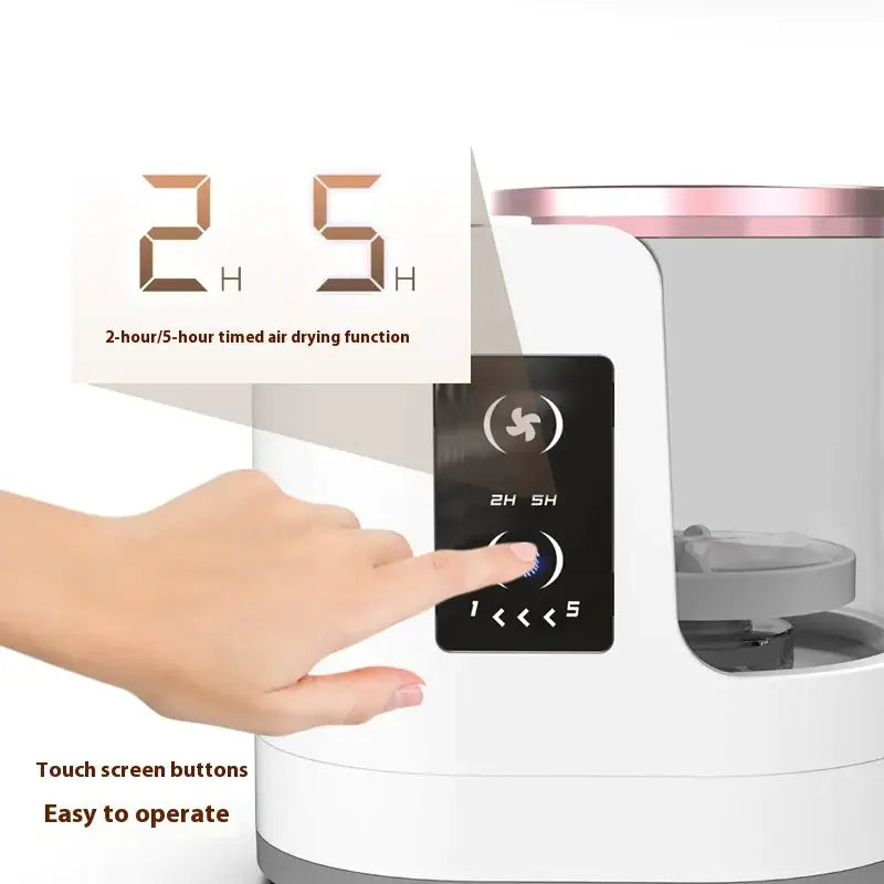 Hand operating the touch screen of SwiftBrush Electric Cleaner & Dryer with air drying timer options.