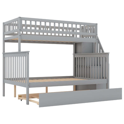 Twin over full bunk bed in gray finish with trundle and staircase for space-saving bedroom solutions.