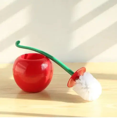 Cherry toilet brush set with a red holder and white bristles, perfect for stylish bathroom cleaning.