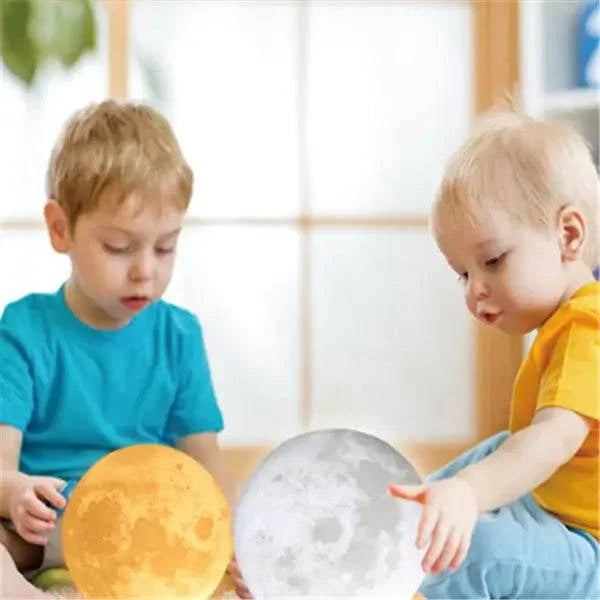 Two children playing with 3D Touch Control Moon Lamp night lights in a cozy indoor setting.