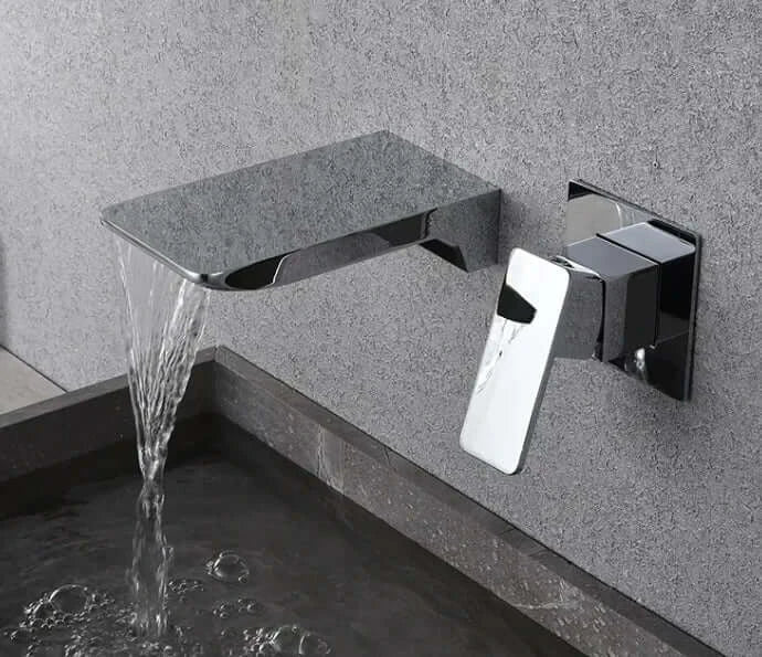 Modern copper core basin tap with sleek design, black and silver finish, pouring water into a stylish basin.