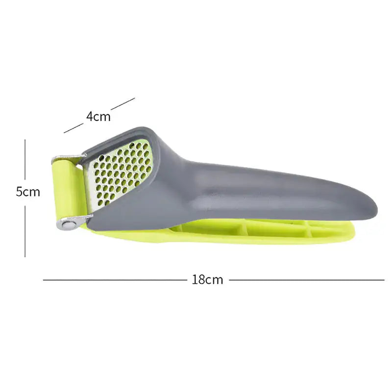 Creative manual garlic press with plastic handle, designed for easy garlic crushing in kitchen.
