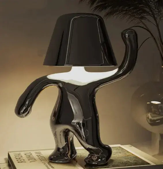 Stylish black LED night lamp with a unique design, offering warm illumination for indoor spaces.