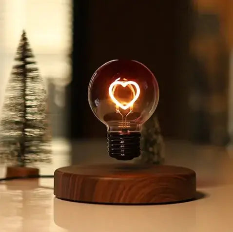 Magnetic suspension bulb night lamp with a heart design, creating a warm, romantic ambiance.