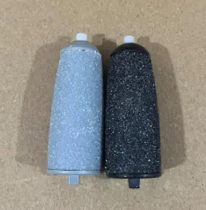SmoothFeet Electric Exfoliator replacement rollers in gray and black, designed for effective foot care and exfoliation.