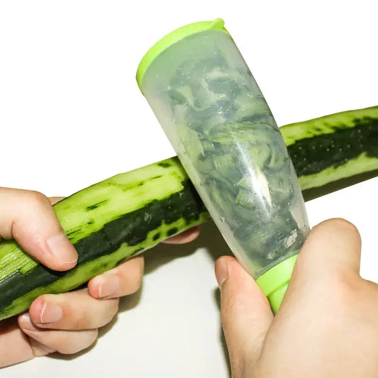 Multi-functional fruit peeler in use on a cucumber, showcasing its innovative storage feature for mess-free peeling.