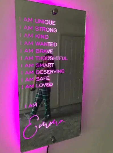 Personalized LED mirror featuring positive affirmations and a warm glow, ideal for bedroom decor.