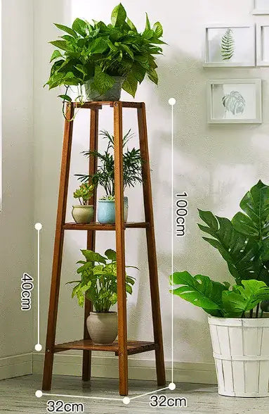 Tiered indoor plant display stand made of wood, showcasing potted plants in a stylish living room setting.