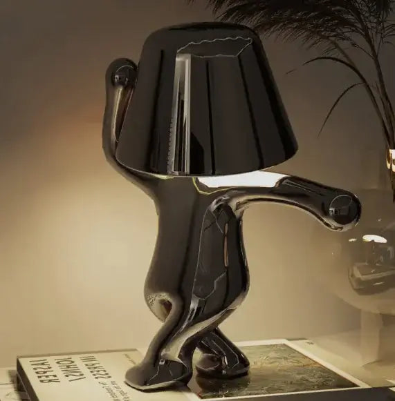 Stylish black LED night lamp in playful design, perfect for enhancing cozy home decor and providing warm illumination.