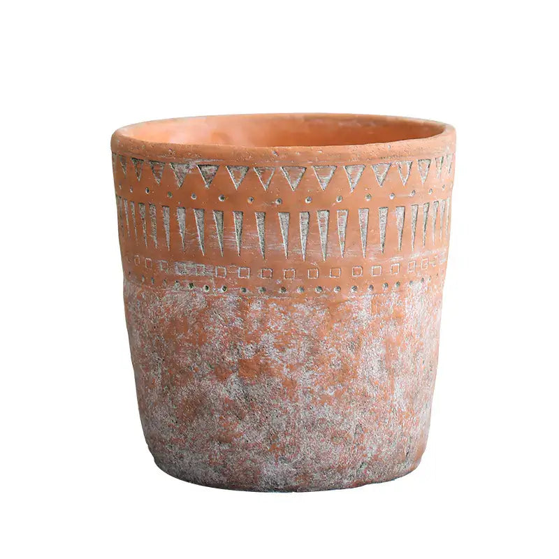 Vintage red clay pot featuring unique African design elements, perfect for home gardening and decoration.