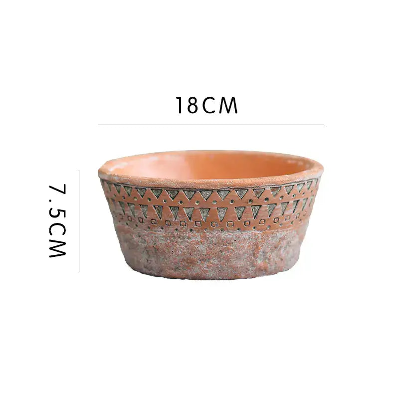 Vintage red clay flower pot with African design, 18cm wide and 7.5cm high, perfect for enhancing home gardening.